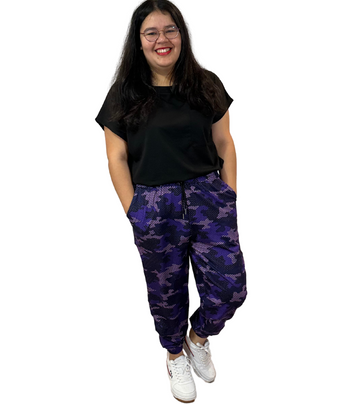 WOMAN WEARING PLUS SIZE PURPLE CAMO JOGGERS
